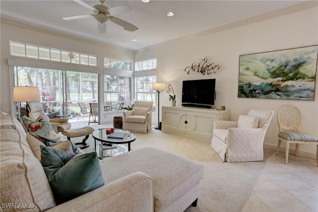 living area with light tile patterned floors, recessed lighting, a ceiling fan, baseboards, and crown molding