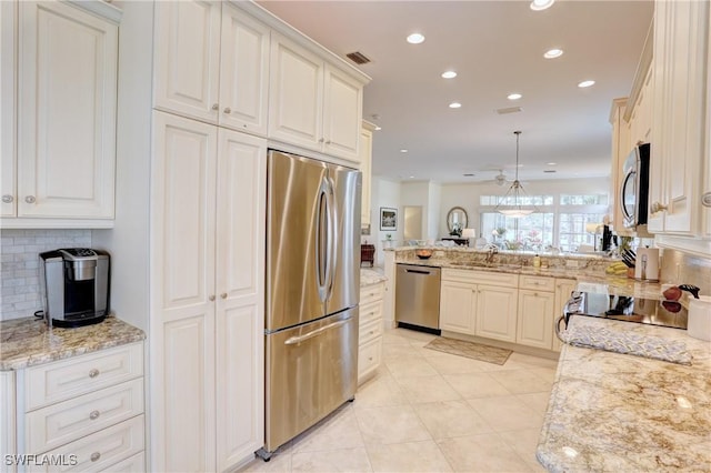 kitchen featuring visible vents, decorative backsplash, appliances with stainless steel finishes, a peninsula, and recessed lighting