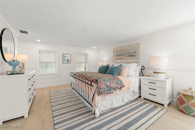 bedroom featuring recessed lighting, visible vents, and light wood-style flooring