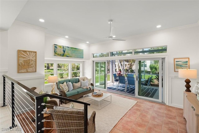 sunroom / solarium featuring a ceiling fan