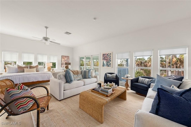 living area with visible vents and ceiling fan