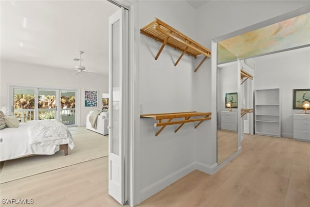 spacious closet featuring ceiling fan and wood finished floors