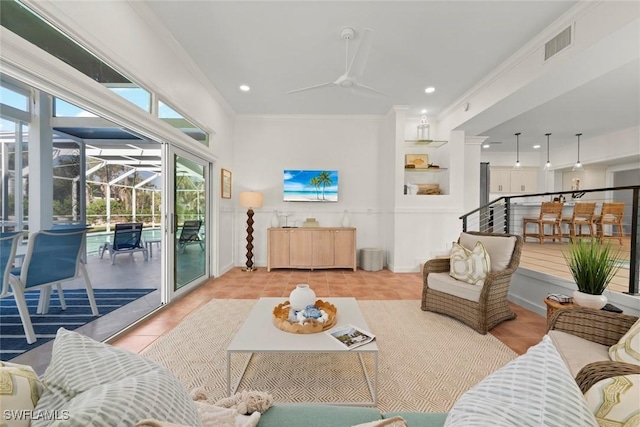 living area featuring light tile patterned flooring, visible vents, baseboards, a sunroom, and crown molding