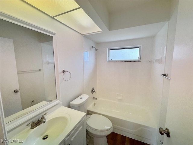 bathroom featuring  shower combination, vanity, and toilet