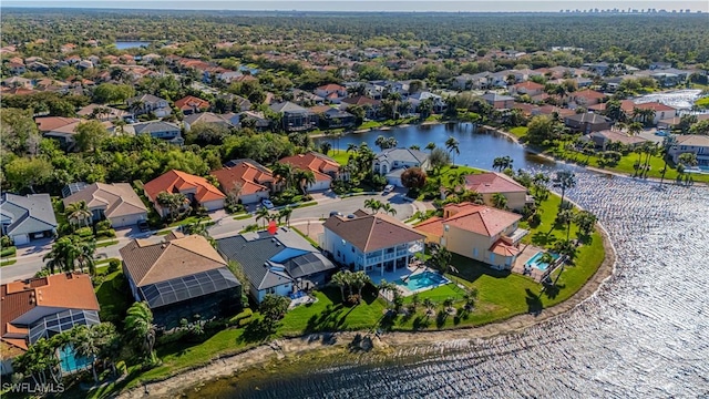 aerial view with a residential view and a water view