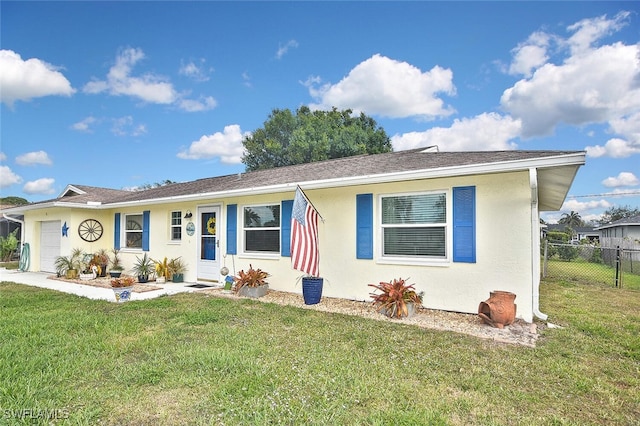 single story home featuring a garage, stucco siding, a front yard, and fence