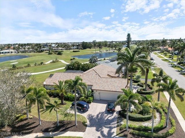 aerial view with view of golf course and a water view