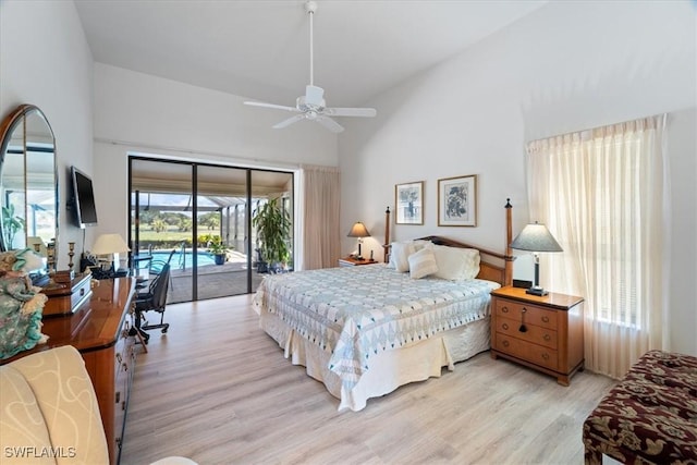 bedroom featuring access to outside, multiple windows, and light wood-style flooring