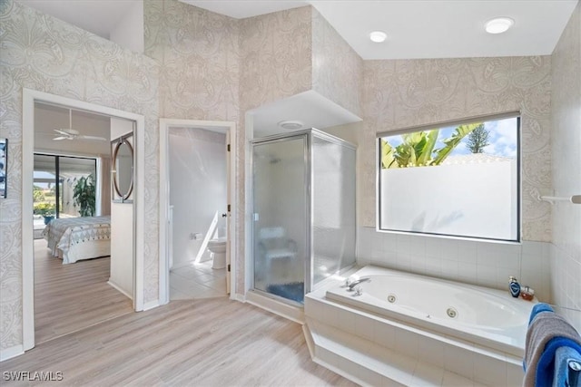 ensuite bathroom featuring wallpapered walls, ensuite bathroom, and a stall shower