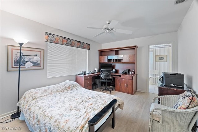 bedroom with light wood-type flooring, visible vents, baseboards, and ceiling fan