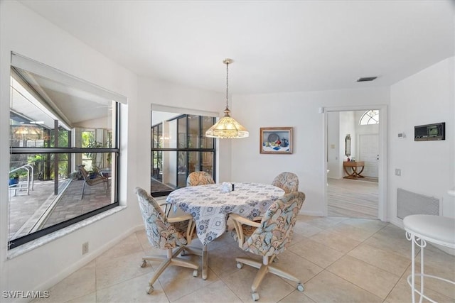 dining space featuring visible vents, baseboards, and light tile patterned floors