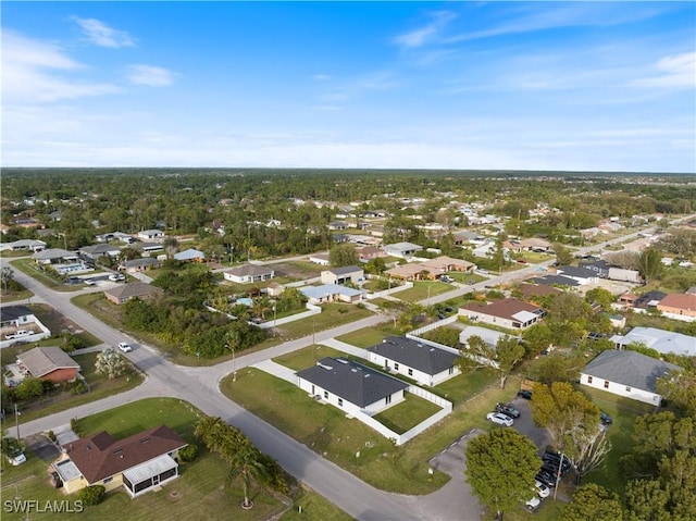 birds eye view of property with a residential view