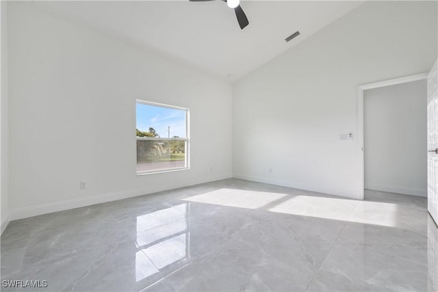 empty room with high vaulted ceiling, visible vents, ceiling fan, and baseboards