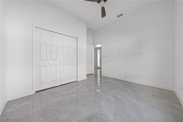 unfurnished bedroom with visible vents, baseboards, ceiling fan, and a closet