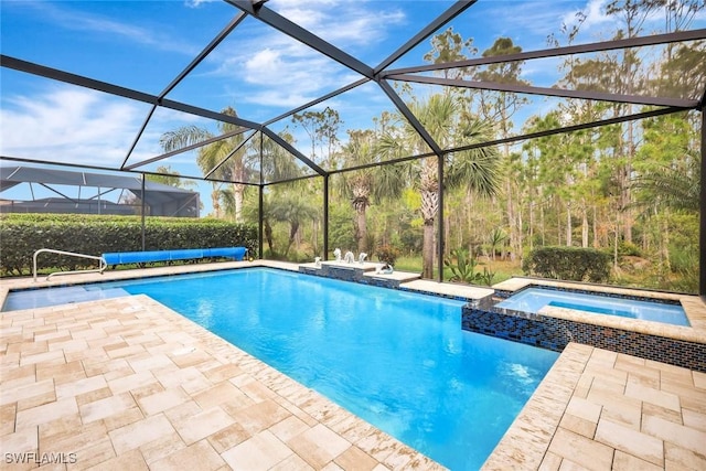 view of pool featuring a patio area, a lanai, and a pool with connected hot tub