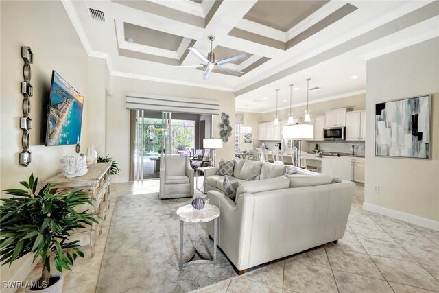 living area featuring ceiling fan, crown molding, coffered ceiling, light tile patterned flooring, and beamed ceiling