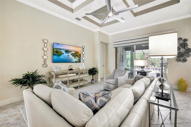 living area featuring crown molding, a ceiling fan, baseboards, and light tile patterned floors