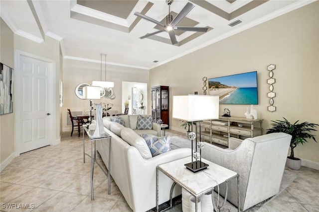 living area featuring light tile patterned flooring, visible vents, baseboards, a ceiling fan, and crown molding