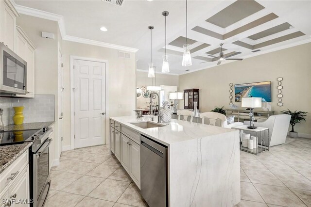 kitchen with stainless steel appliances, ornamental molding, a sink, ceiling fan, and light tile patterned floors