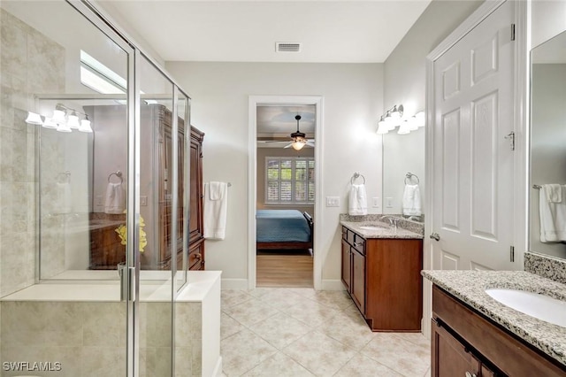 bathroom with a stall shower, visible vents, a sink, and ensuite bathroom