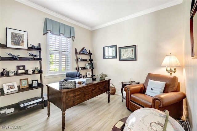 office featuring light wood-type flooring, baseboards, and crown molding