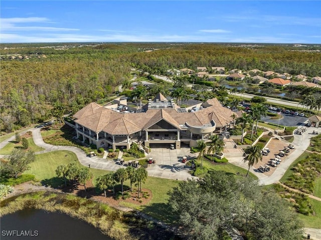 bird's eye view with a water view and a view of trees