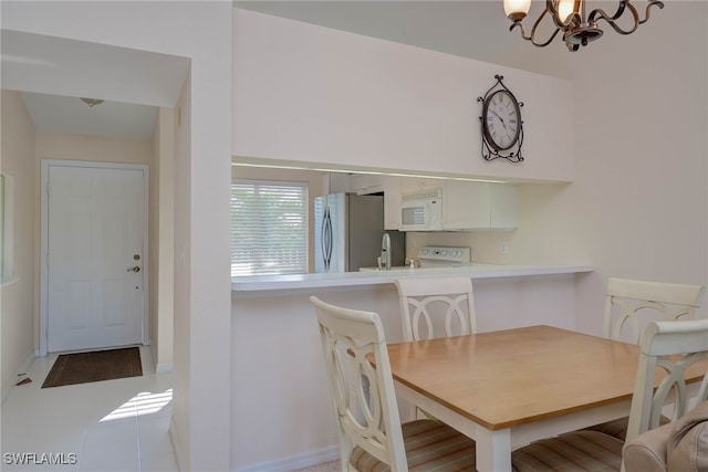 dining area with a chandelier