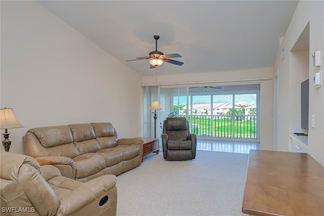 carpeted living area featuring a ceiling fan