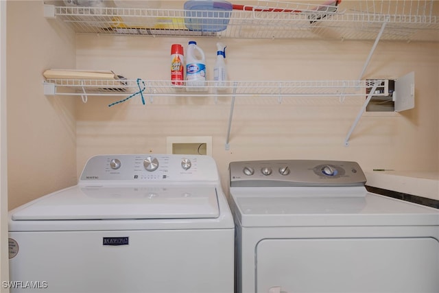 washroom with laundry area and separate washer and dryer