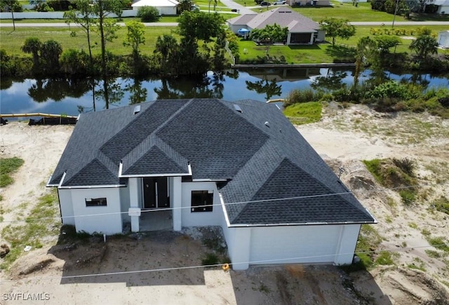 drone / aerial view with a water view