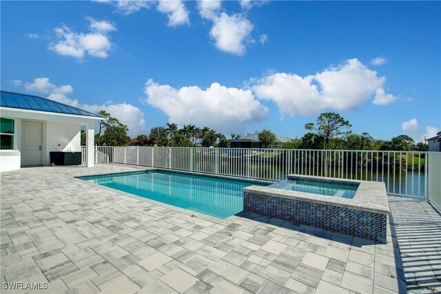 view of pool with a fenced in pool, a patio, fence, and an in ground hot tub