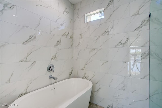 full bathroom featuring a freestanding bath