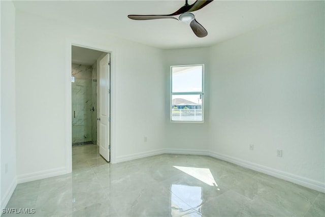 unfurnished bedroom with ceiling fan, ensuite bath, and baseboards