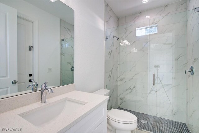 full bath with toilet, vanity, and a marble finish shower