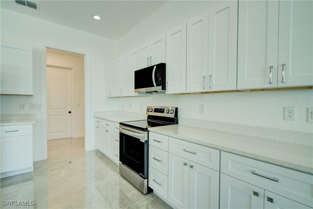 kitchen featuring stainless steel appliances, recessed lighting, light countertops, visible vents, and white cabinets