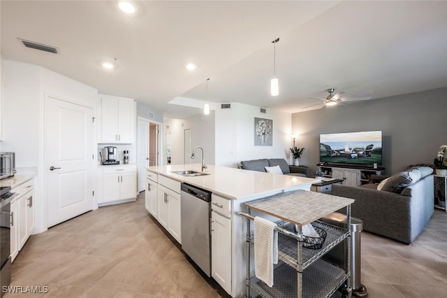 kitchen featuring visible vents, open floor plan, appliances with stainless steel finishes, white cabinetry, and a sink