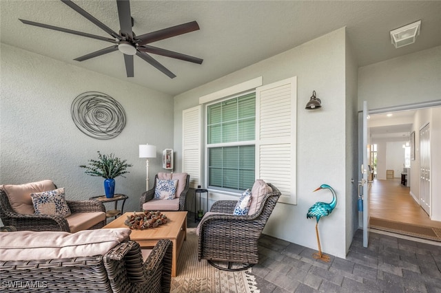 view of patio / terrace featuring an outdoor living space, visible vents, and ceiling fan