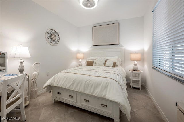 bedroom with baseboards and vaulted ceiling