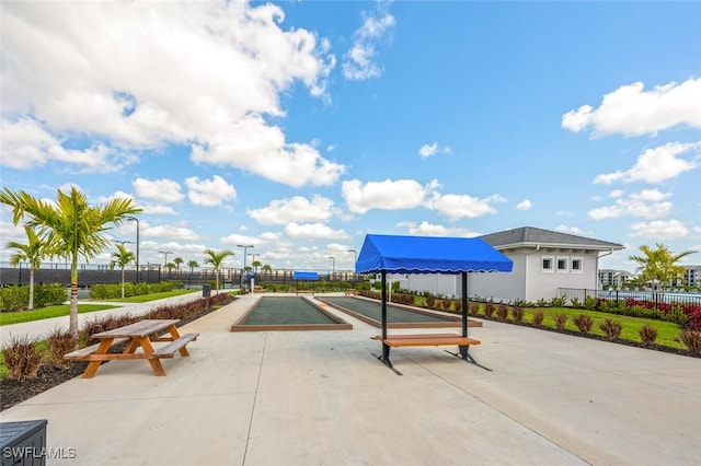 view of community with fence