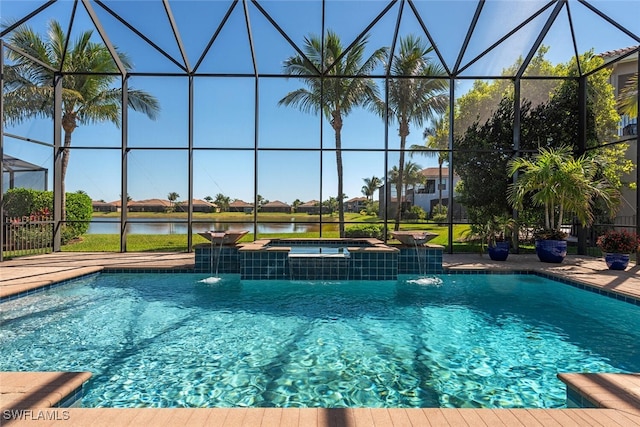 pool featuring a lanai, an in ground hot tub, and a water view