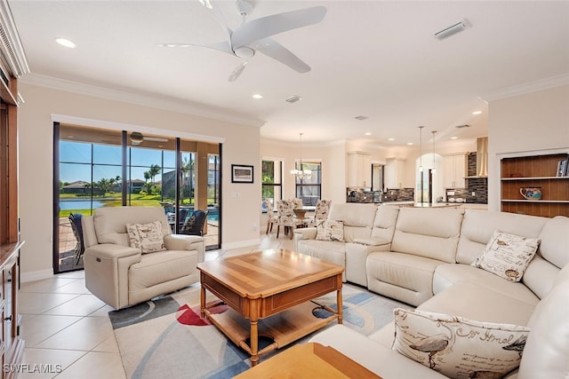 living area with light tile patterned floors, crown molding, and a ceiling fan