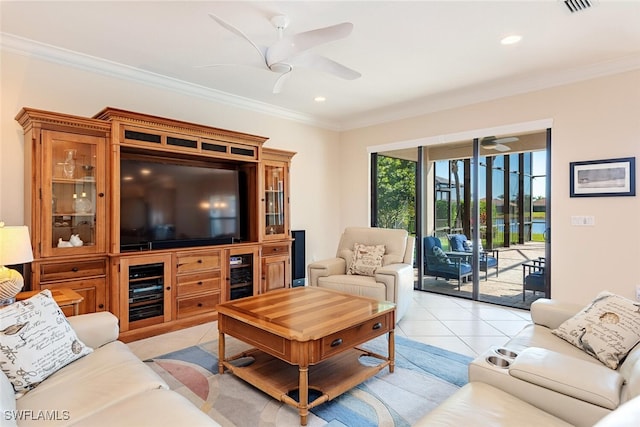 living area featuring wine cooler, ornamental molding, light tile patterned floors, and ceiling fan