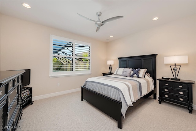 bedroom with a ceiling fan, recessed lighting, light colored carpet, and baseboards