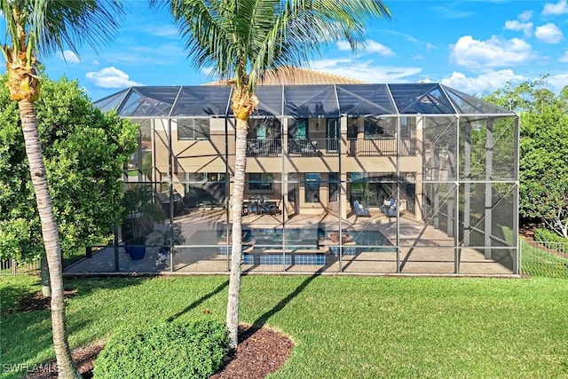 exterior space featuring a yard, an outdoor pool, a lanai, and a patio