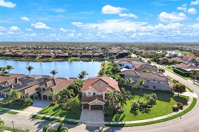 birds eye view of property with a residential view and a water view