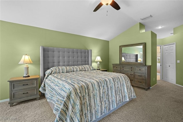 carpeted bedroom with visible vents, baseboards, ceiling fan, and vaulted ceiling