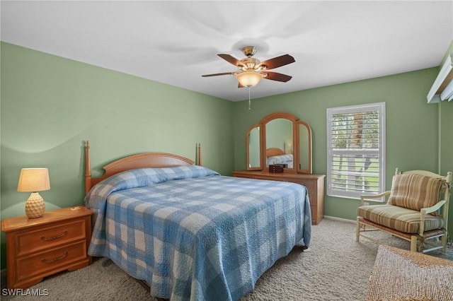 carpeted bedroom featuring a ceiling fan