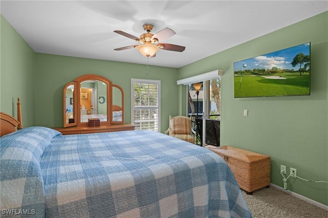 carpeted bedroom featuring baseboards and ceiling fan