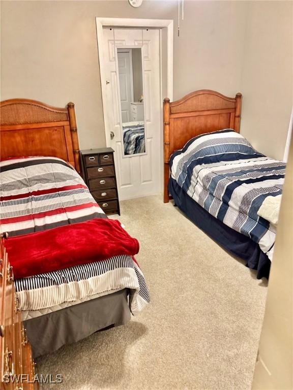 1102 Broad St N, Lehigh Acres, FL 33936 - bedroom with carpet flooring