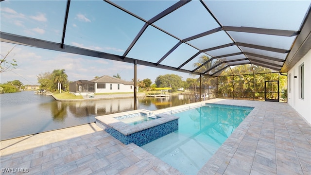 view of swimming pool featuring a patio, a pool with connected hot tub, a water view, and glass enclosure